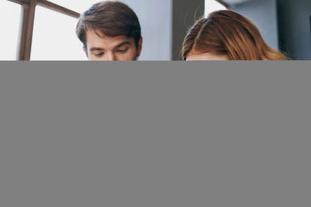 man and woman in business suits work with a tablet officials teamworkの写真素材