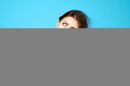 pretty woman in a dress and glasses blue background Lifestyleの写真素材