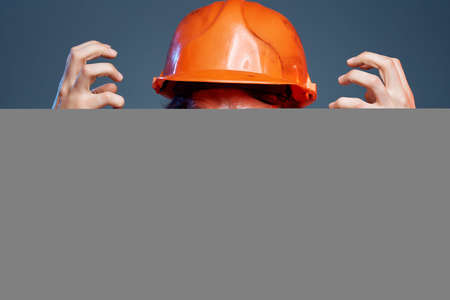 man orange helmet on the head industry isolated backgroundの写真素材