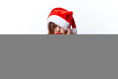 pretty woman wearing santa hat beauty fashion decoration holidayの写真素材