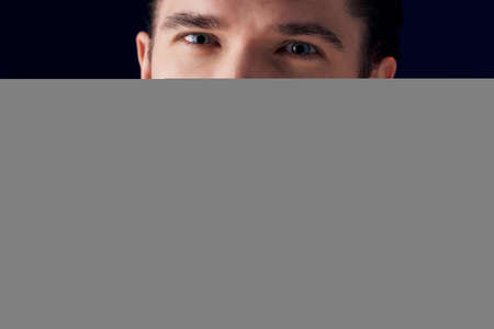 handsome man with beard flowers decoration dark backgroundの写真素材