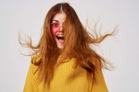 pretty woman in fashionable glasses hairstyle fashion glasses posing Studioの写真素材