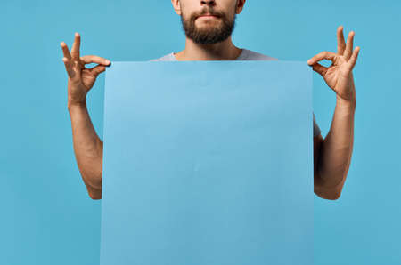 bearded man holding a mockup poster discount isolated backgroundの写真素材