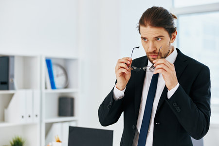 businessman holding a phone telephone office technologiesの写真素材