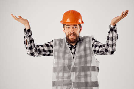 bearded man in orange hard hat construction professional isolated backgroundの写真素材