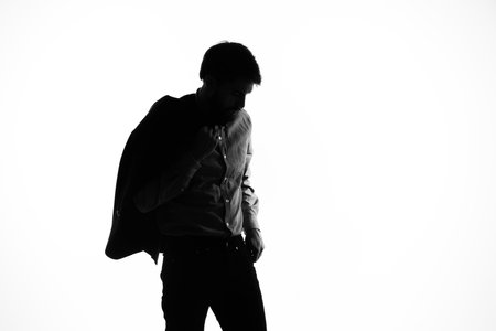 businessmen with a pistol in hand crime hand gesture posing studioの写真素材