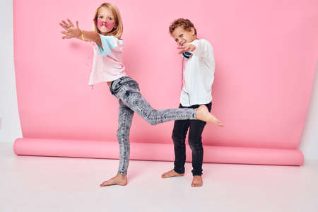 Happy couple child wearing headphones posing Childhood lifestyle conceptの写真素材