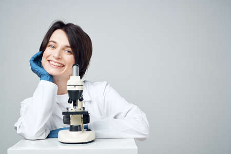 woman scientist laboratory microscope biotechnology researchの写真素材