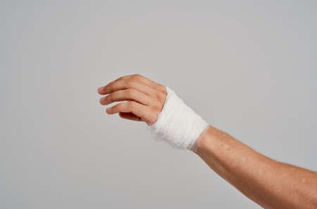 bandaged hand close-up injury medicine hospitalの写真素材