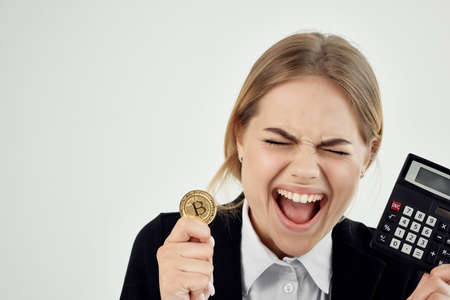 Business woman with cryptocurrency Bitcoin in hands of virtual moneyの写真素材