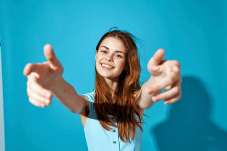 beautiful woman in a blue dress blue background Lifestyleの写真素材