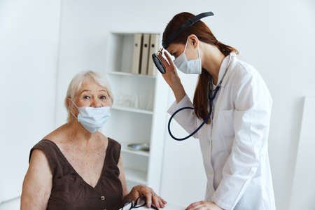 female doctor stethoscope in hand professional diagnosticsの写真素材