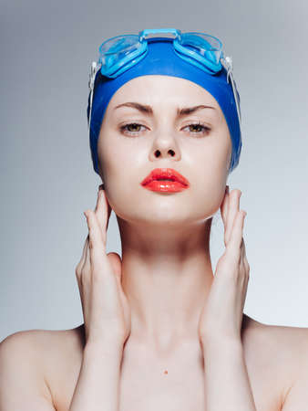 athletic woman with bare shoulders red lips isolated backgroundの写真素材