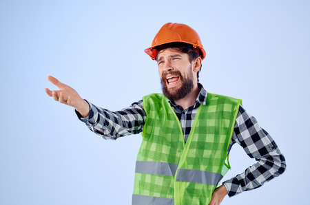 working man in orange hard hat construction professional Studioの写真素材