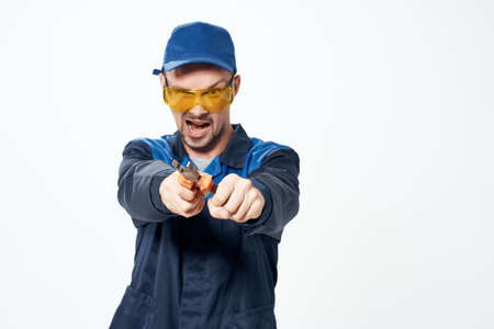 worker in yellow construction glasses emotions isolated backgroundの写真素材