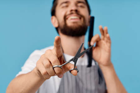 bearded man barbershop haircut blue backgroundの写真素材