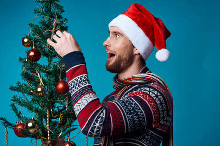 handsome man in New Years clothes advertising copy space blue backgroundの写真素材