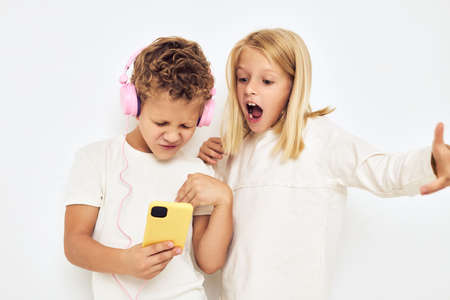 Portrait of his he her with yellow pink headphones isolated backgroundの写真素材