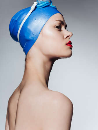 woman in swimming gear naked shoulders red lips close-upの写真素材