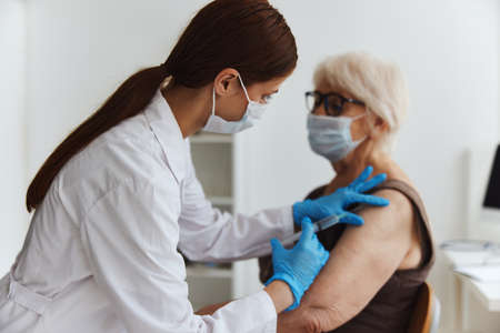 elderly woman vaccine passport virus epidemicの写真素材