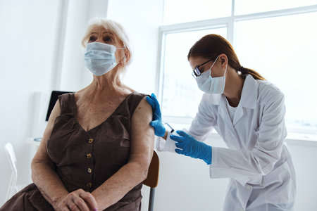 patient and doctor syringe with vaccine immunity protectionの写真素材