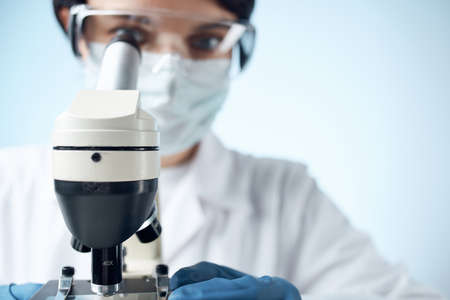 female doctor chemical solutions biologist research study close-up