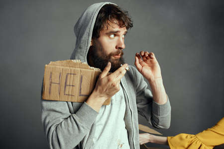 homeless man holding sign help depression discontent