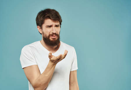 Man in a white t-shirt expressive look discontent Studioの写真素材