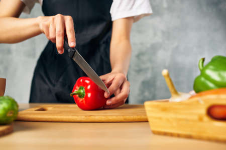 housewife on the kitchen cutting vegetables salad dietの写真素材