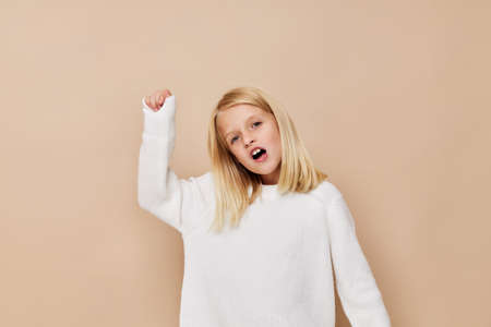 happy child in a sweater, grimaces kids lifestyle conceptの写真素材