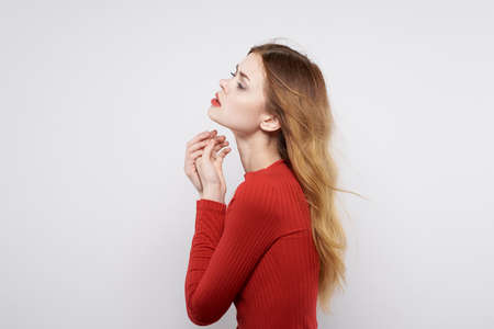 cheerful woman in a red sweater cosmetics emotion isolated backgroundの写真素材