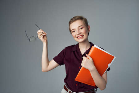 woman students red folder documents lifestyle fashionの写真素材