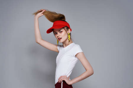 joyful pretty girl red cap posing charm decorationの写真素材