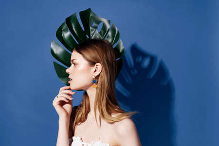 pretty woman green palm leaf posing emotion Lifestyleの写真素材