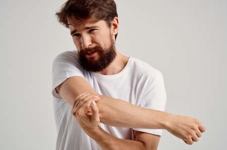 man holding hand injury health problemの写真素材