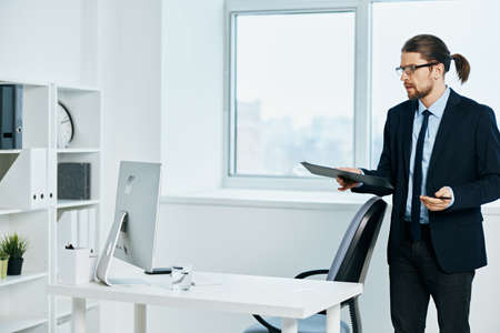 The man in a suit near the desktop work process Lifestyleの写真素材