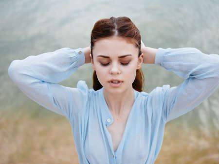 red-haired woman in dress on the beach walk landscape freedomの写真素材
