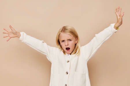 Portrait of a smiling little cutie gestures with his hands cropped viewの写真素材