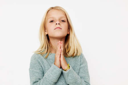 emotional girl gestures with his hands posing studioの写真素材