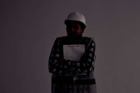 male builder in a white helmet blueprints Professional studio industryの写真素材