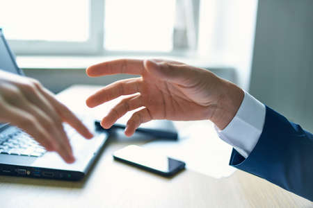 work colleagues shaking hands close-up successful deal workの写真素材