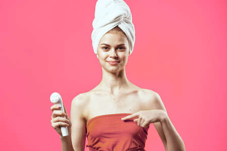 woman with towel on head naked shoulders massage medicine cosmeticsの写真素材