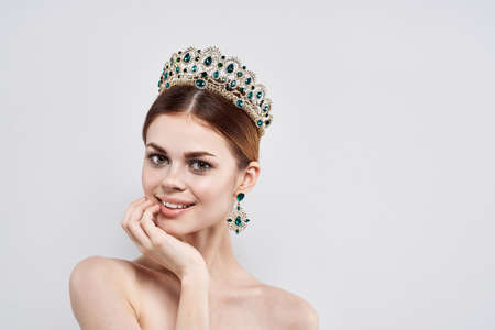 portrait of woman with crown on her head close up.の写真素材