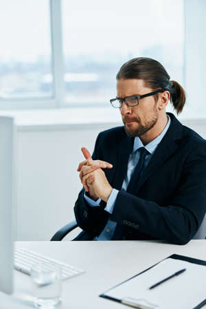 office worker with glasses self-confidence work computer