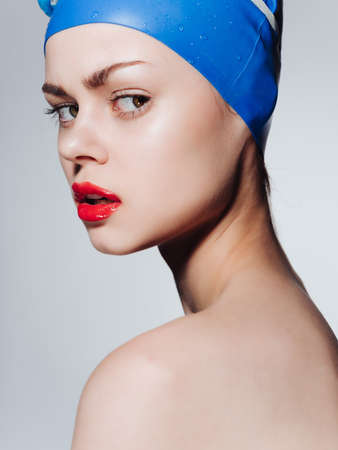 sporty woman with red lips cap for swimming workout emotionsの写真素材