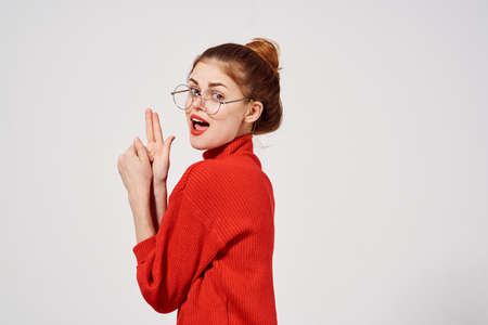 beautiful woman in a red sweater Lifestyle light backgroundの写真素材