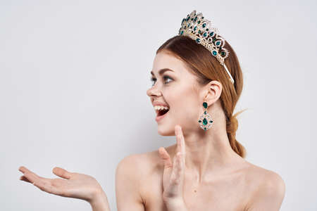 Princess naked shoulders jewelry cosmetics attractive look light background