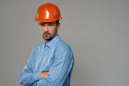 male builder in a blue shirt emotions professional isolated backgroundの写真素材