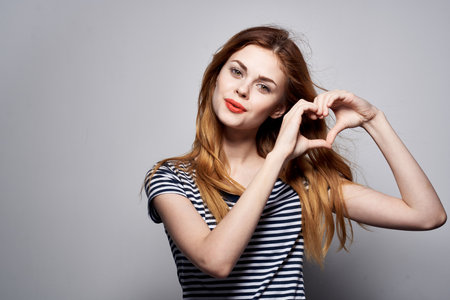 pretty woman hairstyle joy posing fashion attractive look light backgroundの写真素材