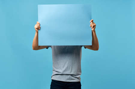 bearded man holding a mockup poster discount isolated background